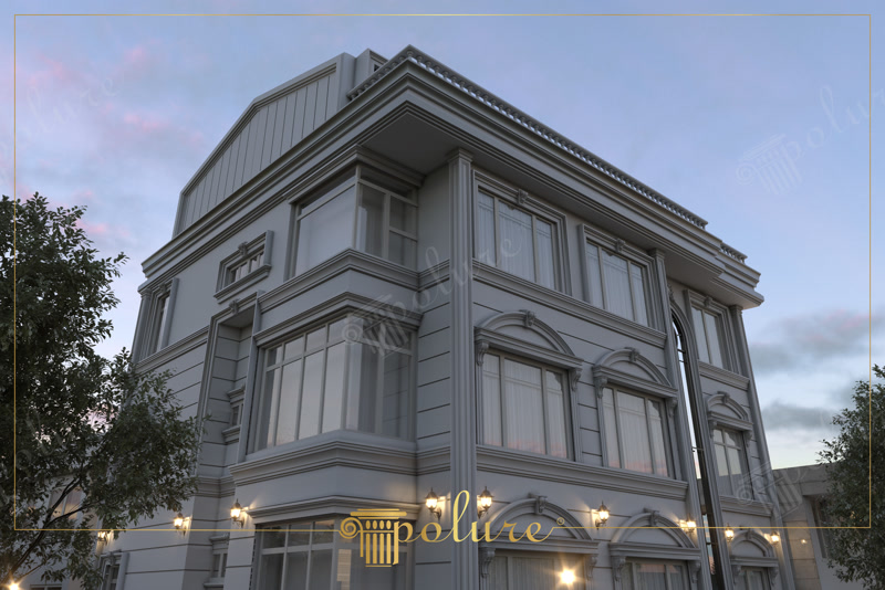 Fațadă modern clasică iluminată seara cu ancadramente din poliuretan la ferestre și pilastri decorativi pe colțuri.