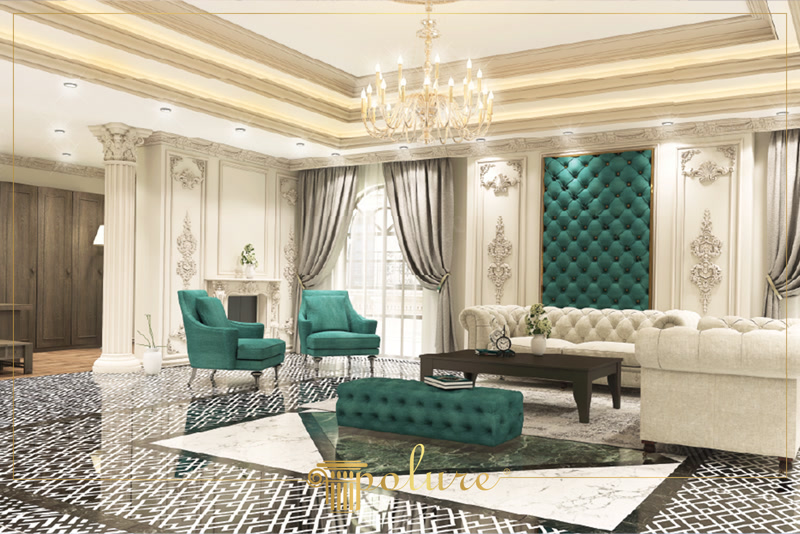 Living clasic cu coloane din poliuretan si decoratiuni Un living clasic decorat cu elemente din poliuretan reprezintă o alegere excelentă pentru familiile care își doresc un spațiu elegant, primitor și extrem de funcțional pentru activitățile zilnice. În această zonă de zi spațioasă, pereții definiți de profile decorative într-o nuanță caldă de crem creează un fundal senin și luminos, ideal pentru momentele de relaxare alături de cei dragi. Nuanțele profunde de verde smarald prezente pe fotoliile confortabile, pe poful central și pe panoul tapițat de pe perete aduc o pată vibrantă de culoare, transformând salonul într-un spațiu plin de viață, căldură și armonie vizuală între stilul tradițional și nevoile moderne ale unei familii.
Detaliile arhitecturale aplicate pe pereți oferă o structură clară și un caracter distins acestei camere de zi primitoare. Coloana decorativă din poliuretan P5840, montată alături de baza specială P5940B, marchează elegant trecerea dintre hol și zona principală de relaxare, oferind o delimitare vizuală subtilă fără a obstrucționa fluxul de lumină naturală. Pe pereții laterali, ornamentele sculptate precum modelele P8026, P8055 și elementele pereche P8081L și P8081R încadrează șemineul și panourile ornamentale. Fabricate dintr-un poliuretan de înaltă densitate, cuprinsă între 150 și 150-220 kg/m³ (țintă ~160 kg/m³), aceste elemente oferă o rezistență excelentă la impactul accidental specific unei case pline de viață și activitate.
Pe lângă valoarea estetică incontestabilă, finisajele din poliuretan aduc beneficii tehnice de lungă durată pentru întreaga locuință. Materialul rezistă fără probleme la variații de temperatură cuprinse între -100 °C / +80 °C și are o rată de absorbție a umidității de sub 1%, ceea ce împiedică apariția fisurilor sau deformarea în timp a elementelor montate. Suprafețele sunt livrate gata amorsate din fabrică, permițând aplicarea rapidă a oricărui tip de vopsea lavabilă pe bază de apă. Această caracteristică face ca curățarea zilnică sau îndepărtarea urmelor accidentale să fie un proces simplu, păstrând pereții curați și proaspeți fără eforturi mari de întreținere din partea proprietarilor.
Lumina caldă distribuită de candelabrul central, combinată cu lumina naturală ce pătrunde prin ferestrele mari arcuite, accentuează detaliile fine ale fiecărui profil decorativ din poliuretan. Atmosfera primitoare este completată de pardoseala lucioasă cu modele geometrice, care reflectă delicat formele stucaturilor de pe tavan și pereți. În acest salon modern-clasic, fiecare detaliu a fost gândit pentru a crea un mediu confortabil, călduros și prietenos pentru familie și oaspeți. Investiția în profile decorative durabile garantează menținerea aspectului impecabil al livingului pentru mulți ani, transformând locuința într-un adevărat cămin de neuitat.