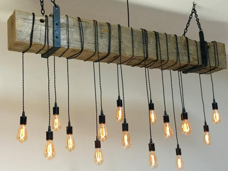 Billet Beam Rafter Lighting Chandelier Floor Lamp Models If you're looking to add a rustic industrial flair to your home restaurant bar or any space, reclaimed barn beam light fixtures might be just what you're looking for. Some may contain more or less gaps crack cut marks or other unique features All measurements are approximate Length of wires and chain can be customized to your ceiling height Here are some key details about our reclaimed barn beam light fixtures Beam Specifications Reclaimed beams from Midwest barns over 100 years long a beam The height and width of the beams usually ranges from 7 to 9 Not all beams are the same Some may contain more or less gaps crack cut marks or other unique features All measurements are approximate Construction and Safety Made in accordance with UL components and safety testing Metal hanging brackets are used LED Edison Bulbs are used traditional bulbs are also available Built with UL listed components Wires are wrapped around the beam A beam that stands approximately 24 from the ceiling Distance from beam to lowest bulb 30 For best display of Edison bulb filaments we recommend connecting to a dimmer switch Wires chain to electrical box Can be operated from the center of the beam or from the center of the beam Please specify your preference International deliveries are also available Contact for price quote